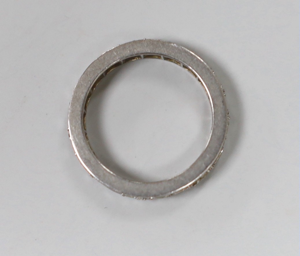 A white metal and diamond set full eternity ring, size J/K, gross weight 4.3 grams.